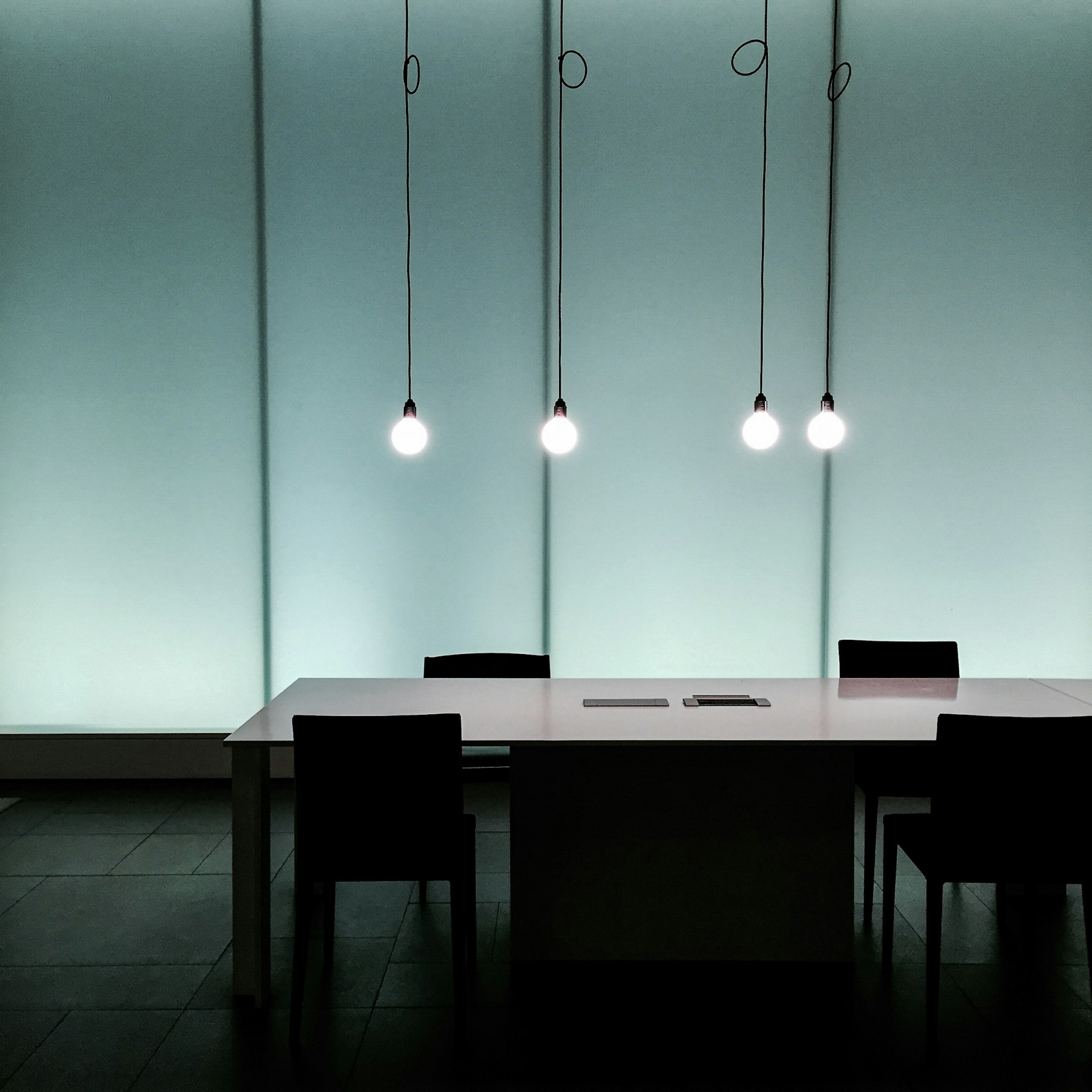 a table with a laptop on it in a room